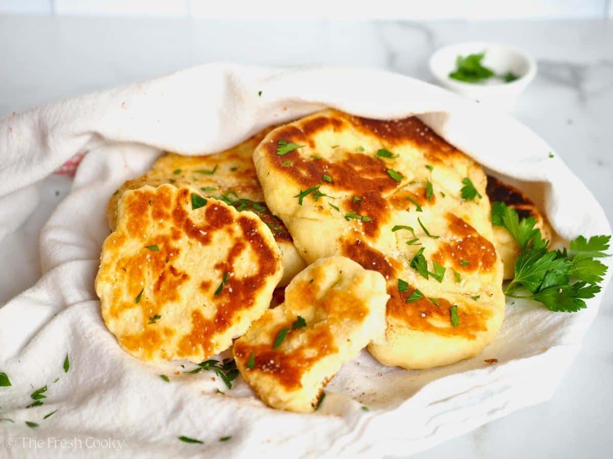 Various sizes of buttery naan bread.