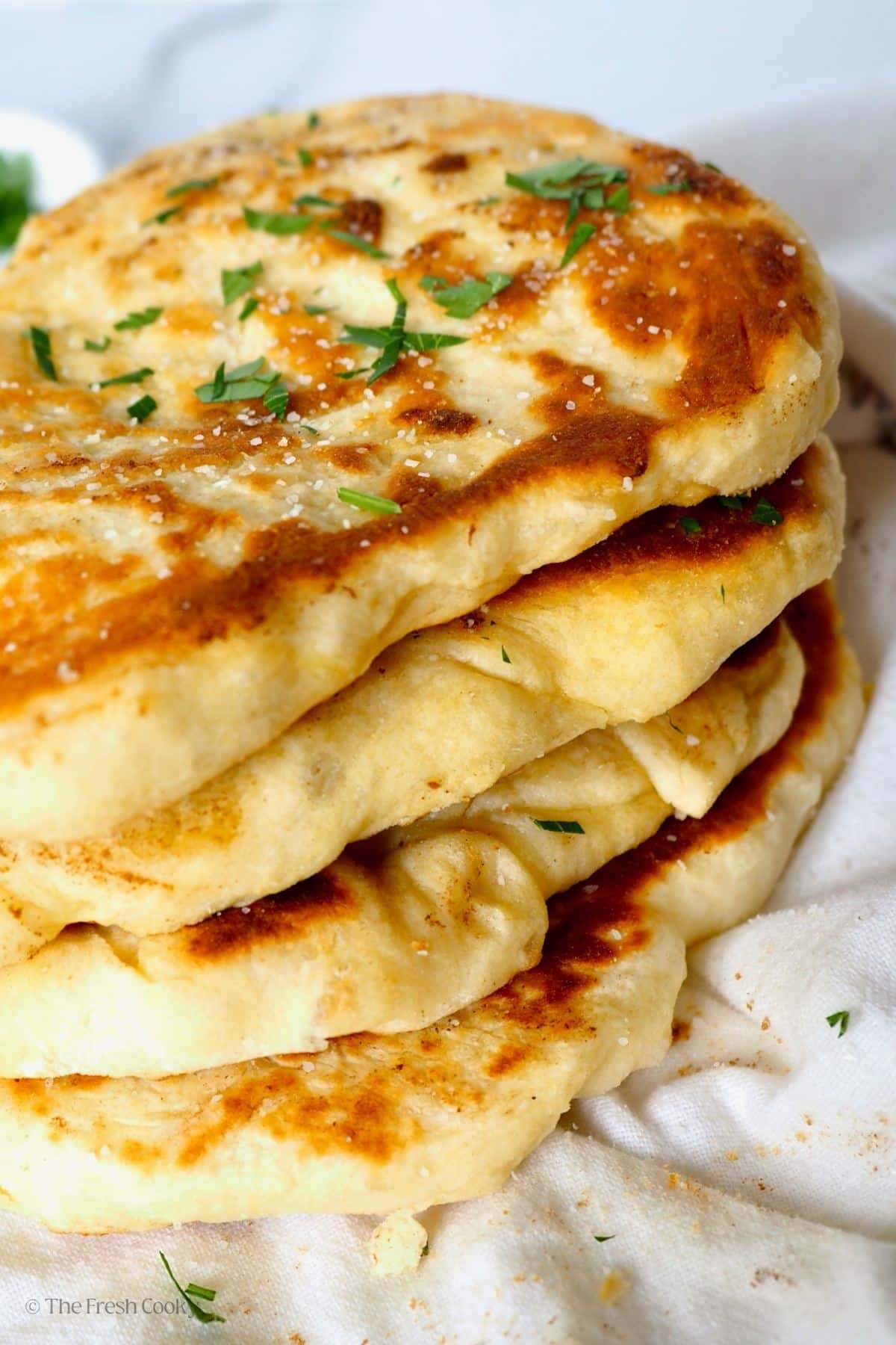 Stacked baked naan bread. 