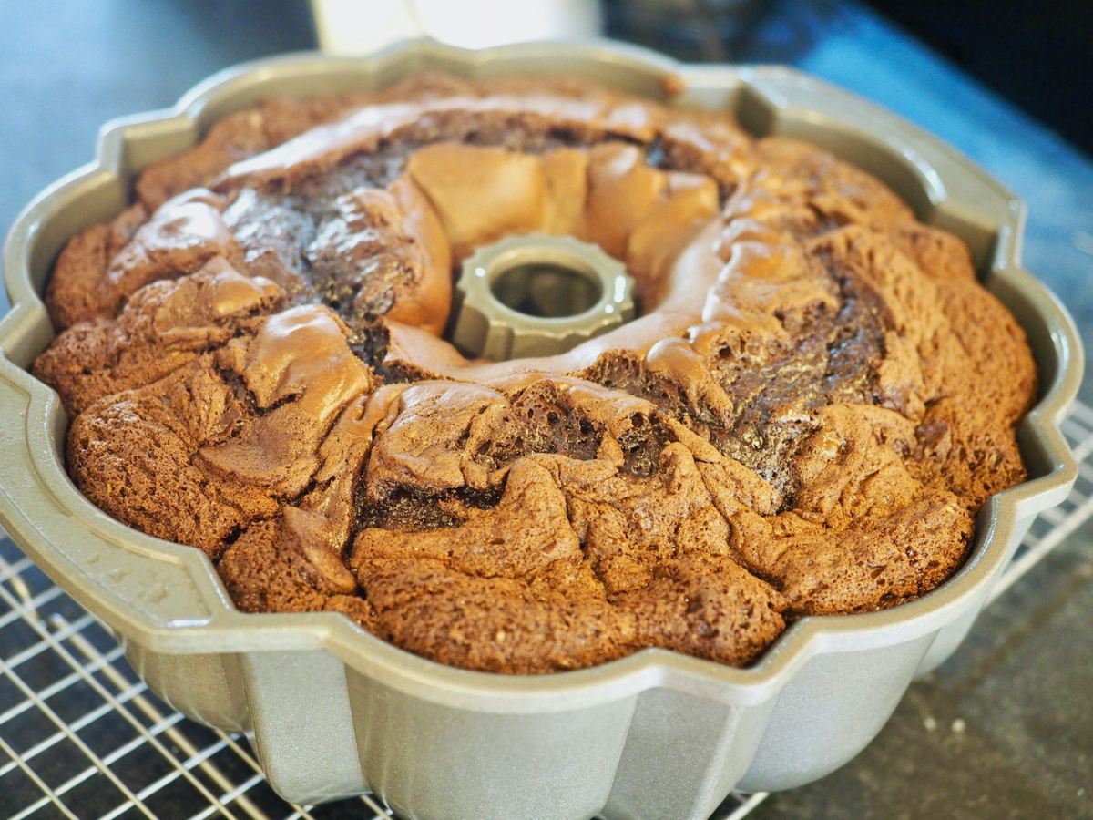 Chocolate bundt cake cooling in pan.