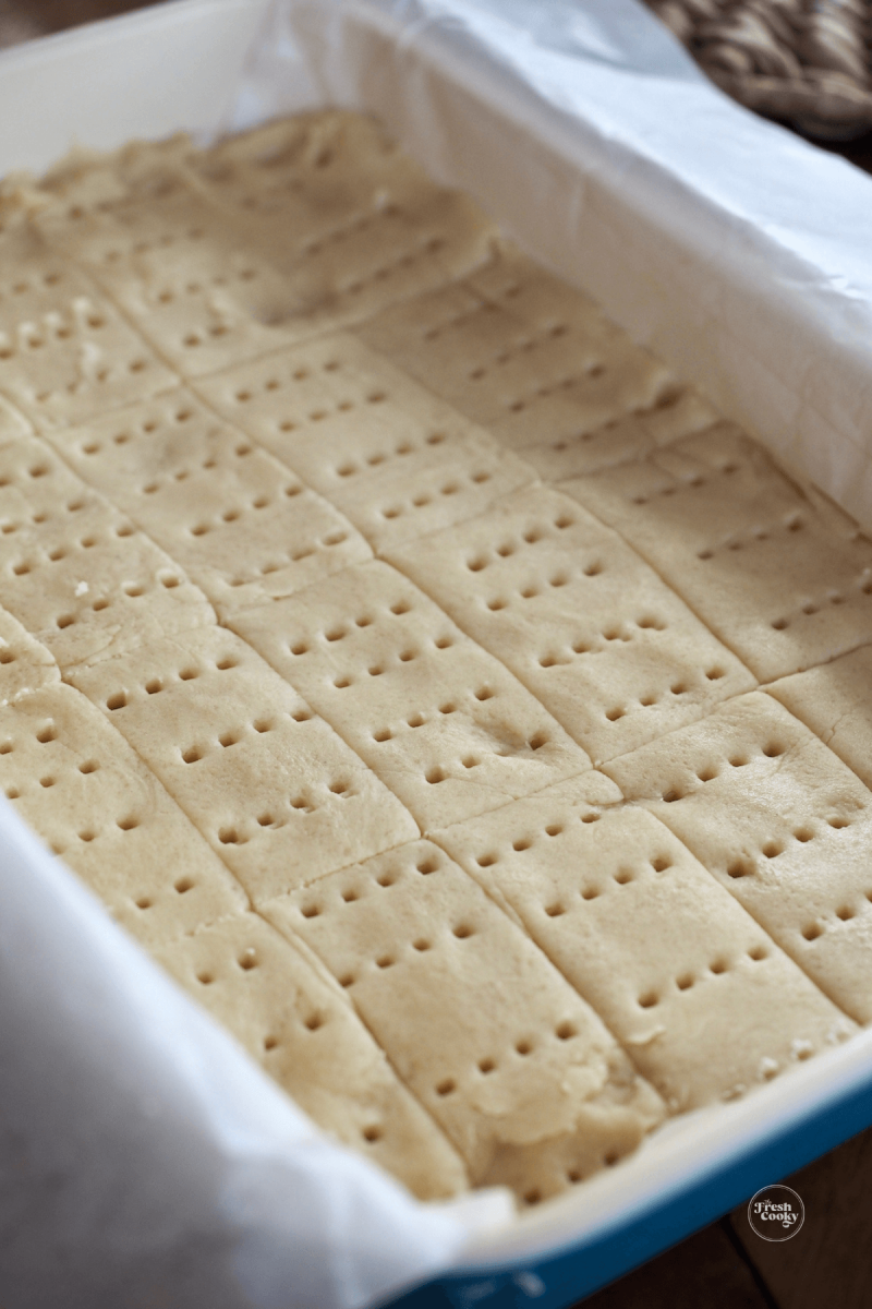 https://www.thefreshcooky.com/wp-content/uploads/2020/11/shortbread-scored-and-pricked-with-tines-of-fork-800x1200.png