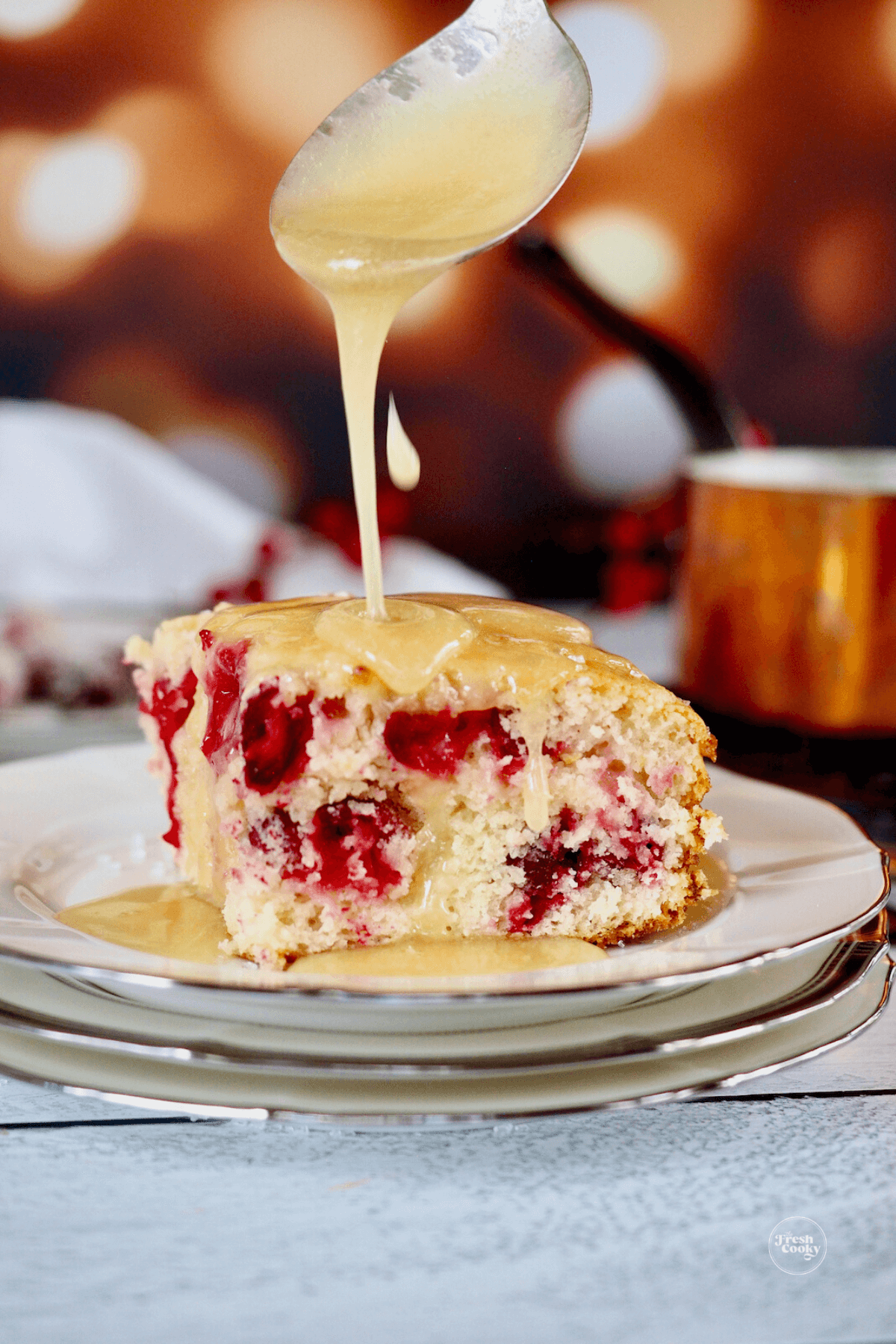 https://www.thefreshcooky.com/wp-content/uploads/2021/11/cranberry-cake-recipe-with-butter-sauce-3.png