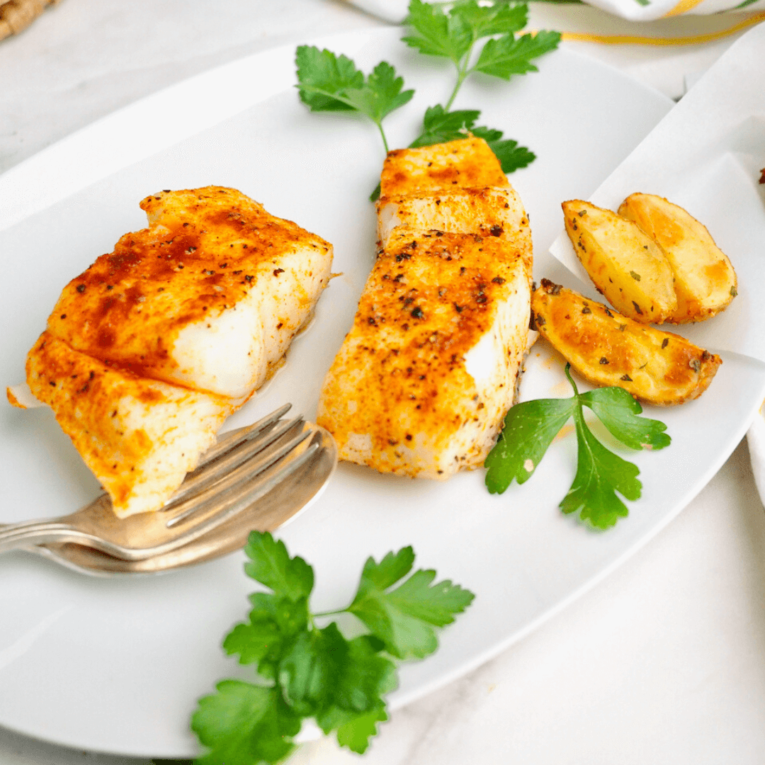 https://www.thefreshcooky.com/wp-content/uploads/2022/08/Halibut-on-plate-with-parsley-garnish-square.png
