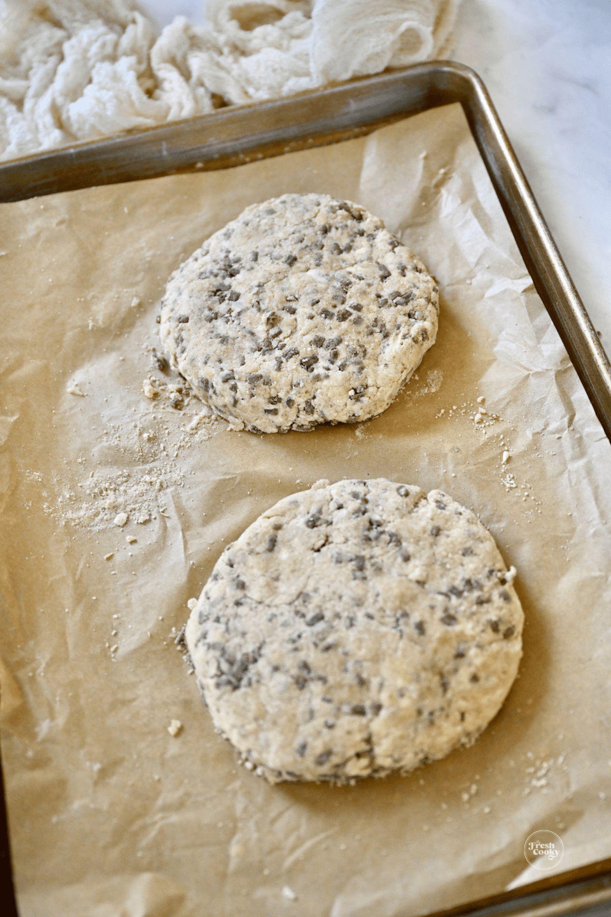 https://www.thefreshcooky.com/wp-content/uploads/2023/01/Two-scone-discs-on-baking-sheet-1.png