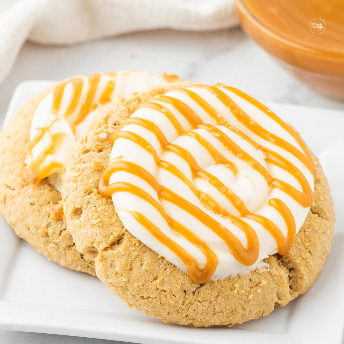 https://www.thefreshcooky.com/wp-content/uploads/2023/03/Salted-Caramel-Cheesecake-Cookies-Square.png