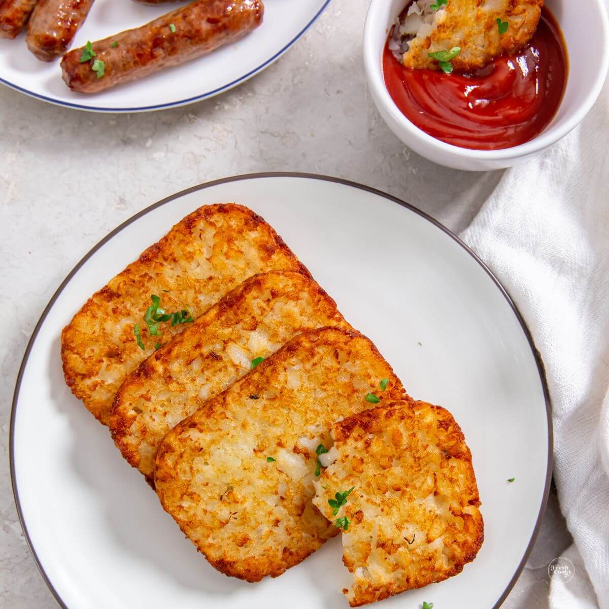 https://www.thefreshcooky.com/wp-content/uploads/2023/05/Hash-brown-patties-in-air-fryer-square-1.jpeg