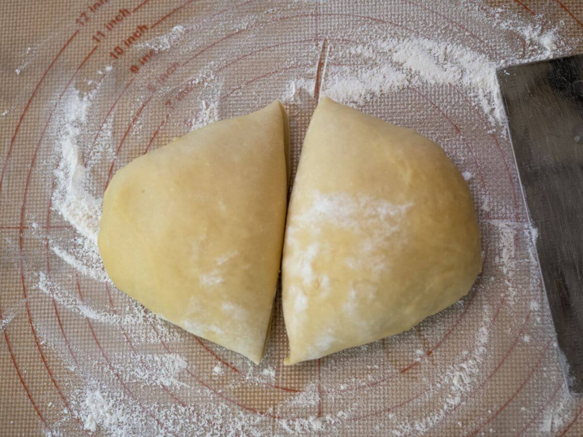 A disc of dough has been split in half.